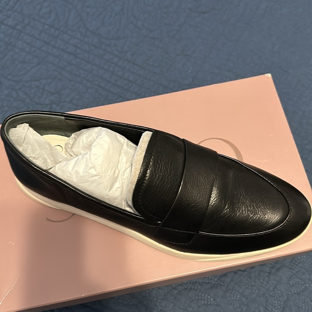SARTO slip-on black women’s shoes.